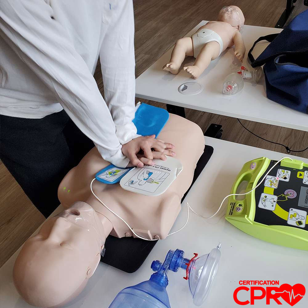 CPR training with mannequin and AED for certification in Fort Worth.