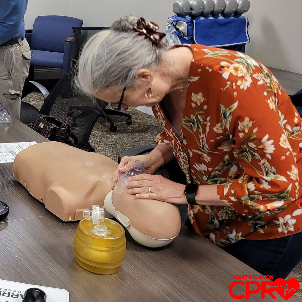 CPR training session with adult mannequin in Fort Worth.