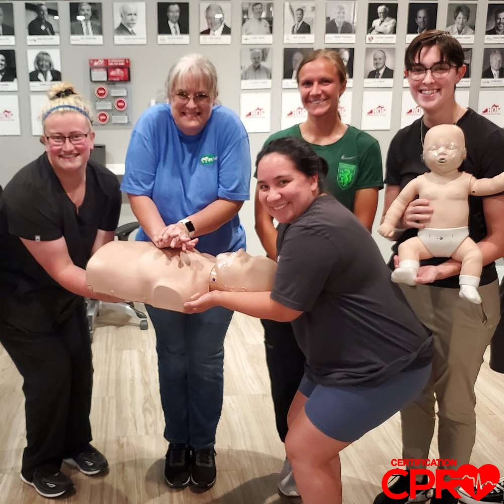 CPR training class in Fort Worth with students practicing on mannequins.
