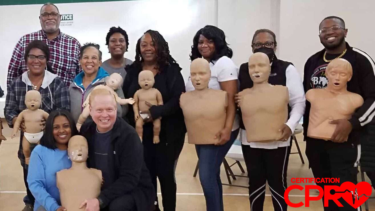 Group CPR training session in Fort Worth with mannequins for certification.