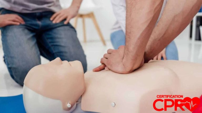 CPR training session with a man practicing on a mannequin in Fort Worth.